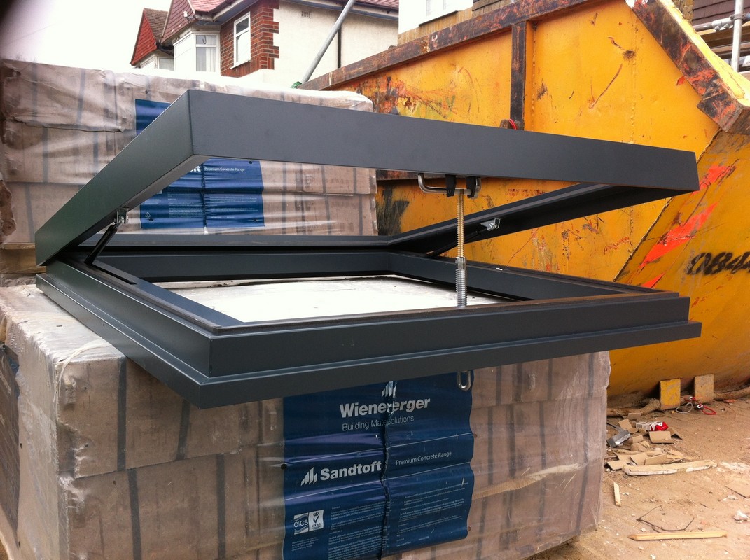 Opening flat roof skylight in anthracite grey installed in Dulwich